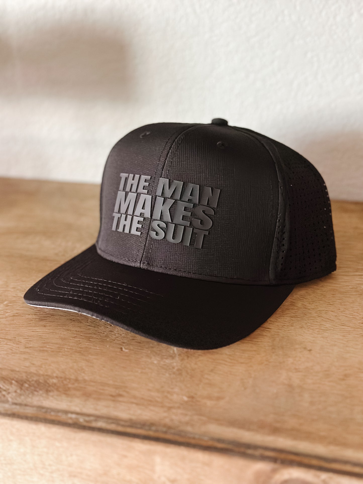 The Man Makes The Suit Hat